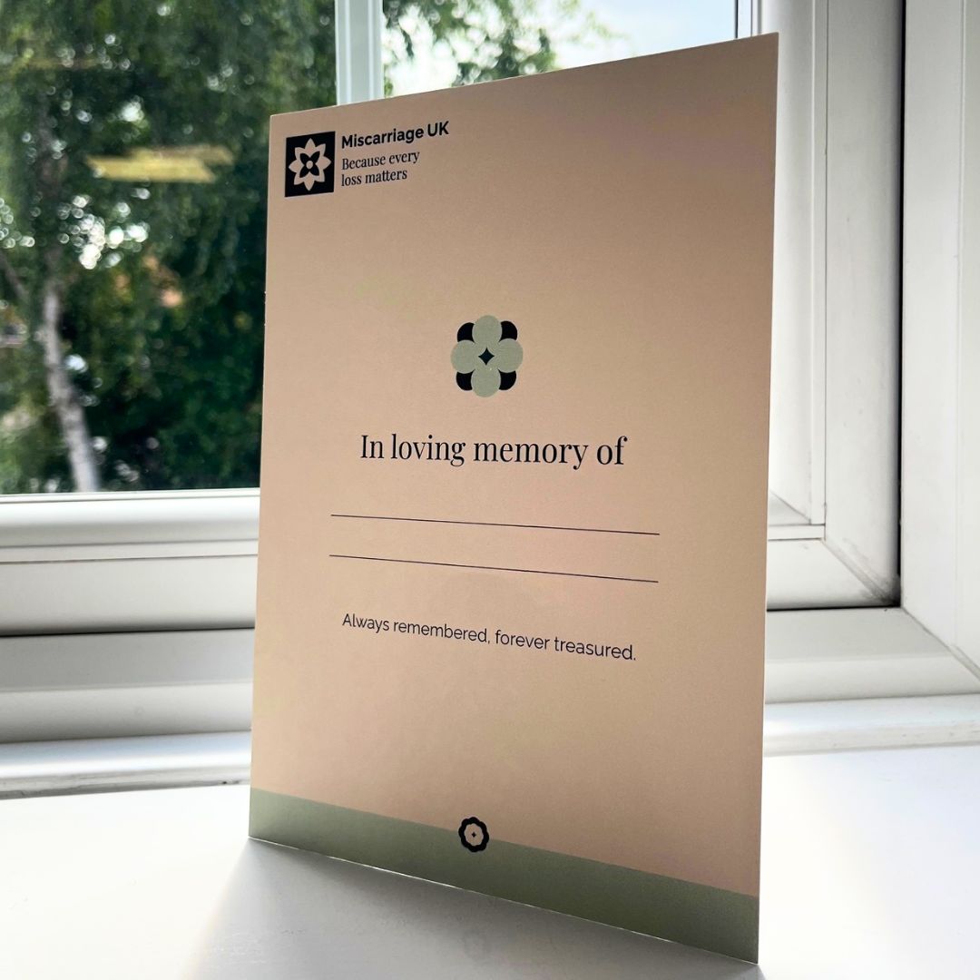 A5 cream memorial certificate on a windowsill